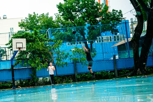 Beginner basketball player performing vertical jump exercises to increase dunking ability